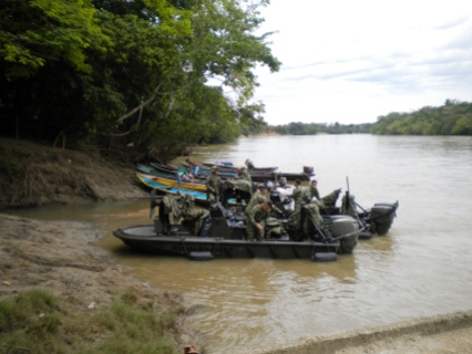 Military partrolling for paramilitaries on the river